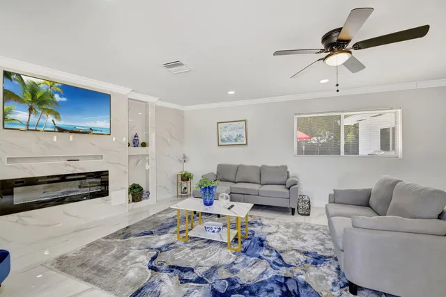 a dining room with furniture and view kitchen