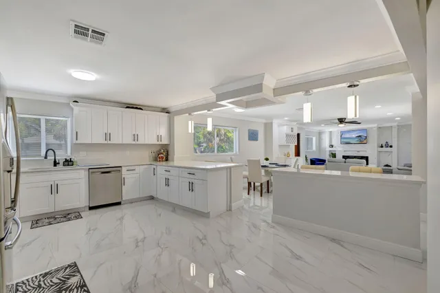 a kitchen with a table and chairs in it