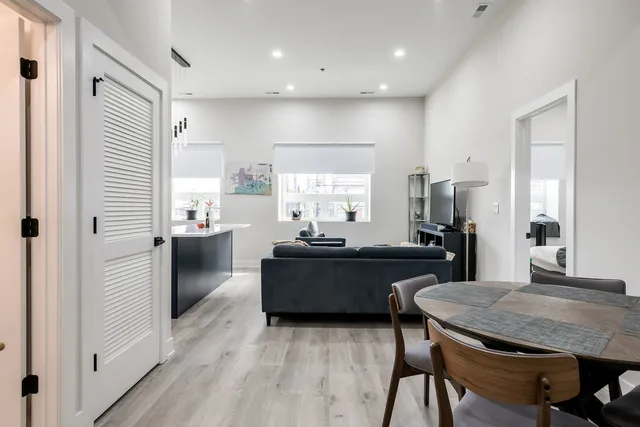 a kitchen with a table and chairs in it