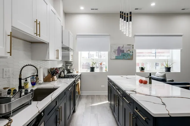 a kitchen with a sink stove and cabinets