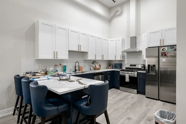 a kitchen with a dining table and chairs