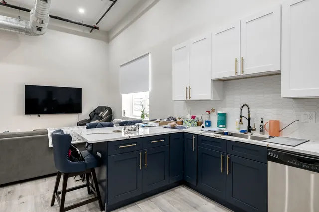 a kitchen with a sink and cabinets