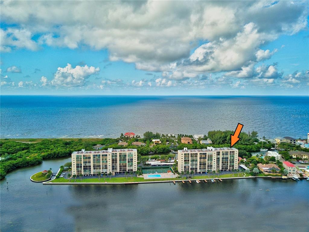 a view of a lake with a house in the background