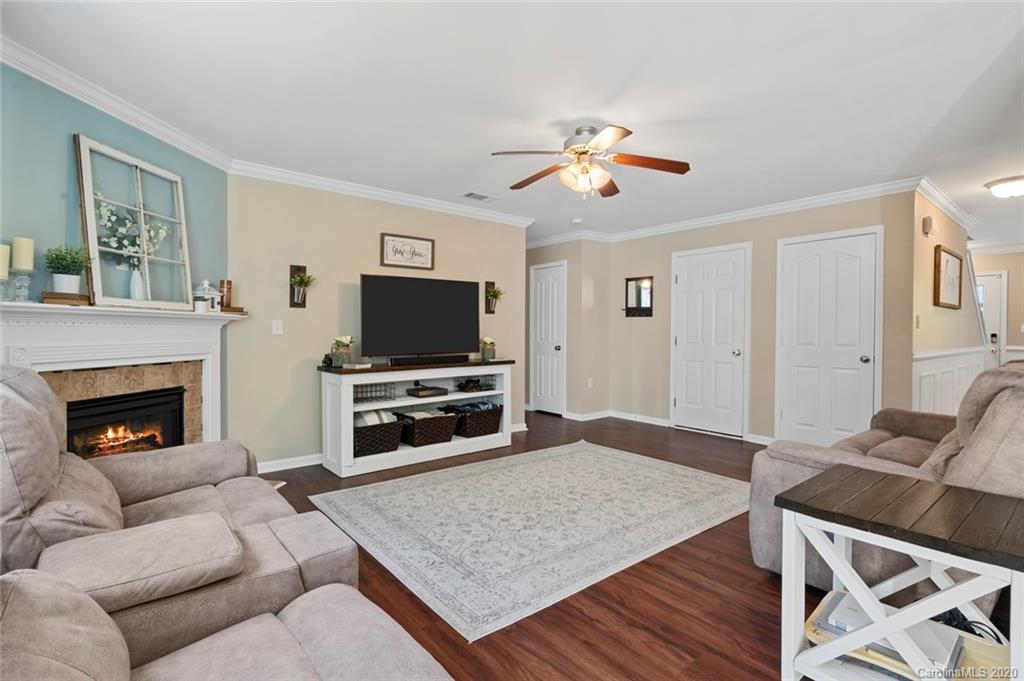 2966 Arthur Road Indian Land, SC 29707 - Photo 14 of 48 a living room with furniture a flat screen tv and a fireplace