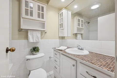 a bedroom with a bed and a lamp