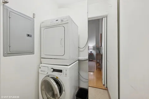 a living room with furniture a flat screen tv and a potted plant