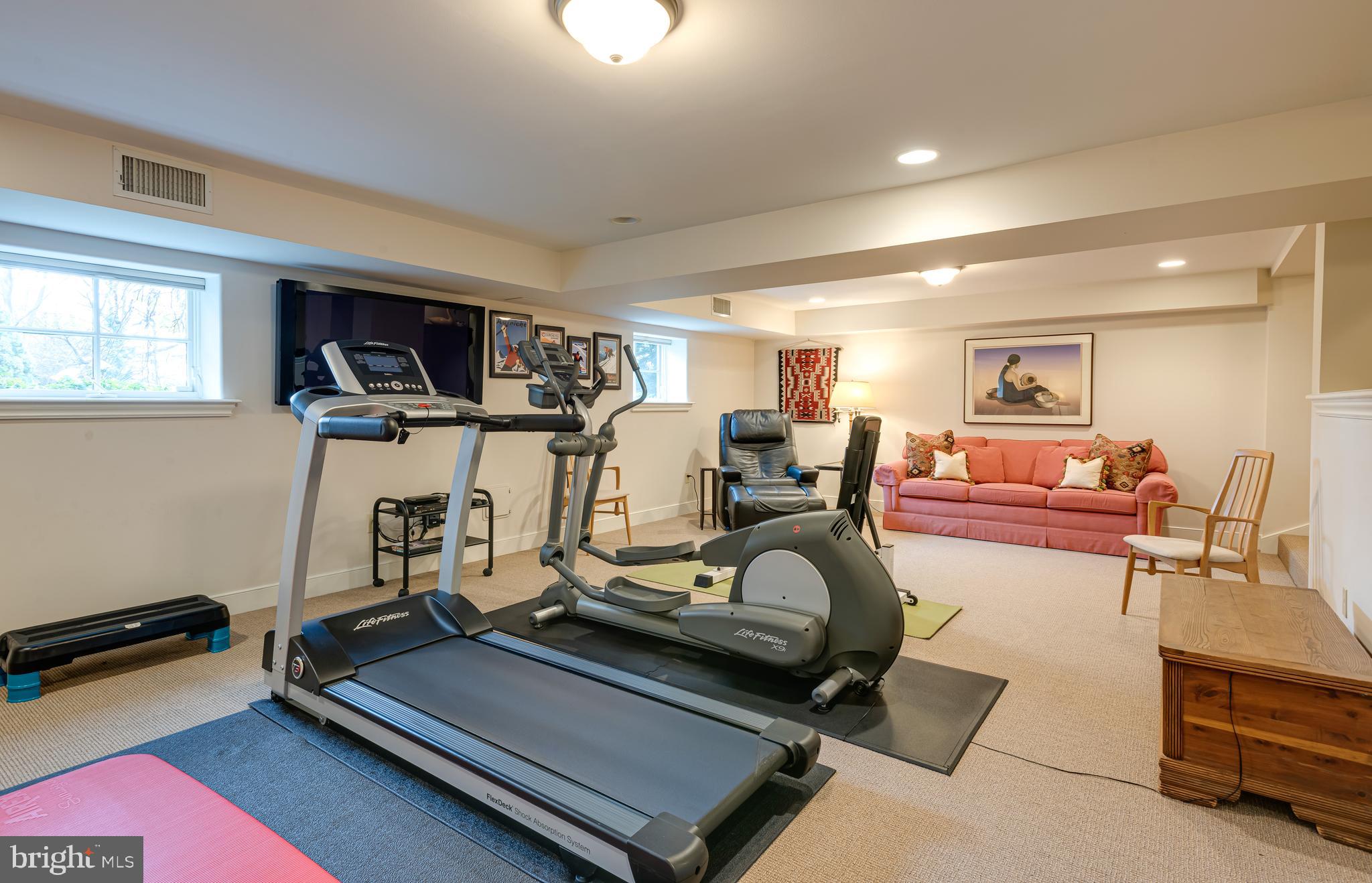 620 North Spring Mill Road Villanova, PA 19085 - Photo 70 of 118 a room with gym equipment and a flat screen tv
