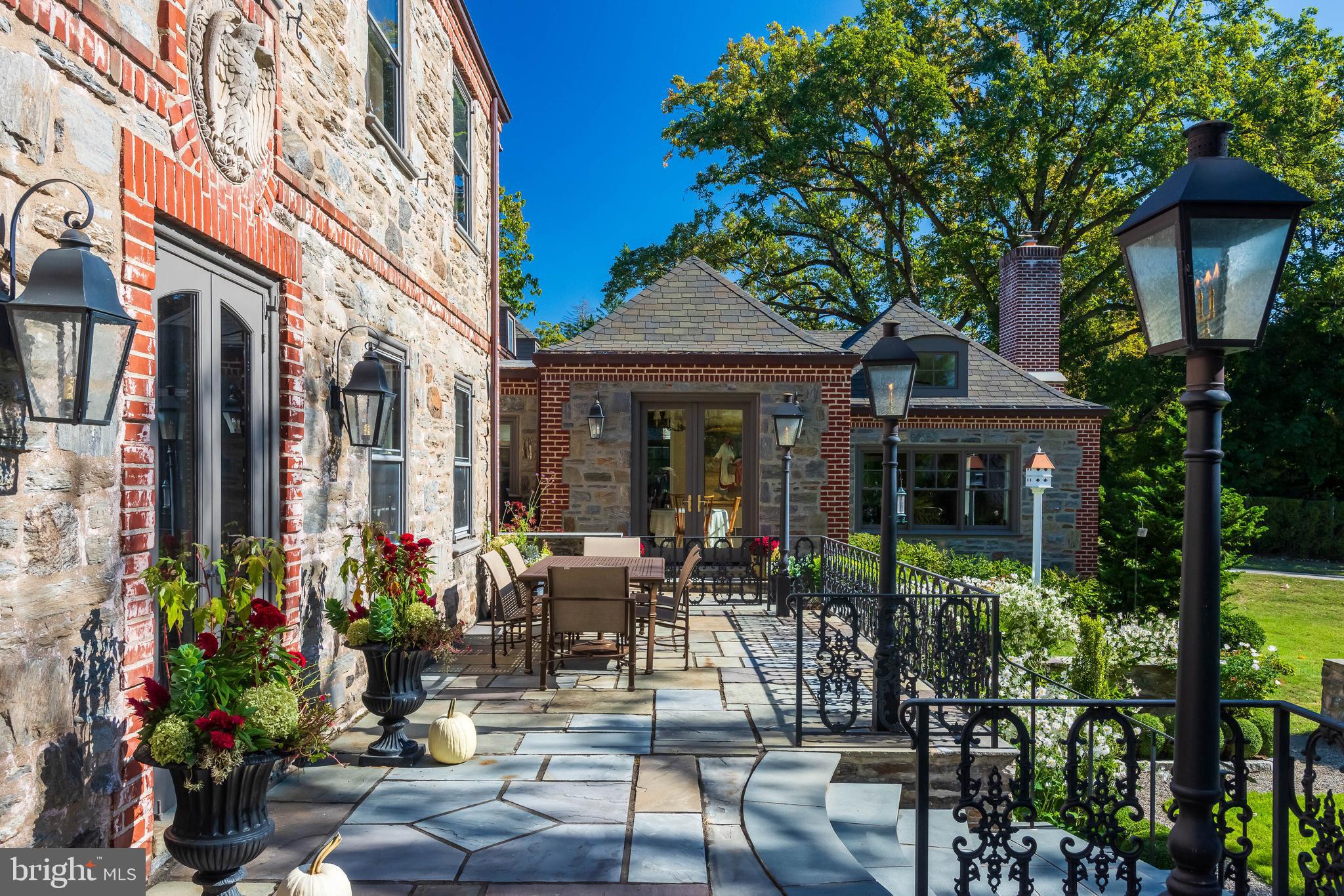 620 North Spring Mill Road Villanova, PA 19085 - Photo 88 of 118 a view of a patio with table and chairs and potted plants
