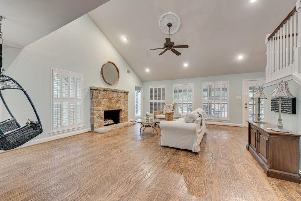 2 Eastshore Road Heath, TX 75032 - Photo 3 of 30 a living room with furniture a fireplace and a flat screen tv