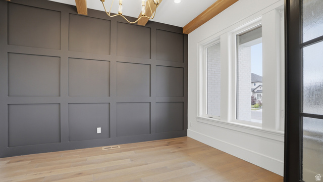 1682 North 1950 W Street, Unit 9 Provo, UT 84604 - Photo 13 of 84 Accent wall featuring dark paneled wainscoting