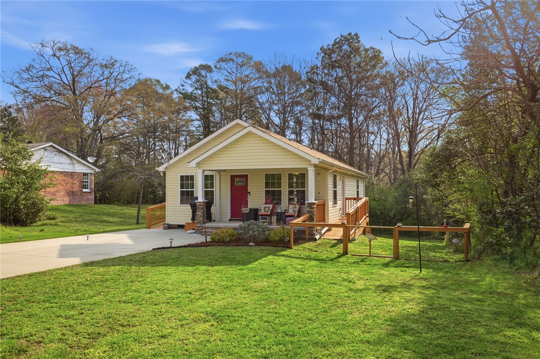 310 North Church Street Walhalla, SC 29691 - Photo 1 of 30 Charming home with inviting front porch and a lush green lawn.