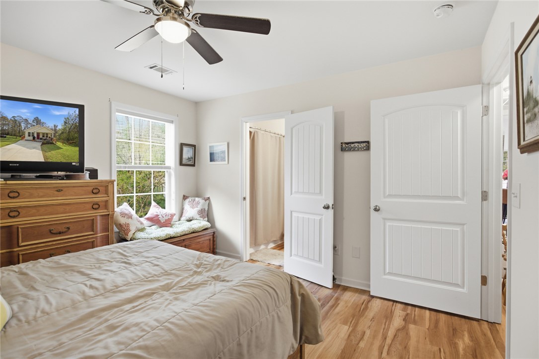 310 North Church Street Walhalla, SC 29691 - Photo 12 of 30 This bright room features a window bench and wood-look flooring.