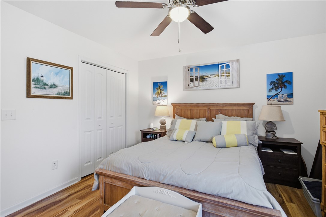 310 North Church Street Walhalla, SC 29691 - Photo 13 of 30 This restful bedroom features warm wood-like LVP flooring and a convenient ceiling fan for comfort.