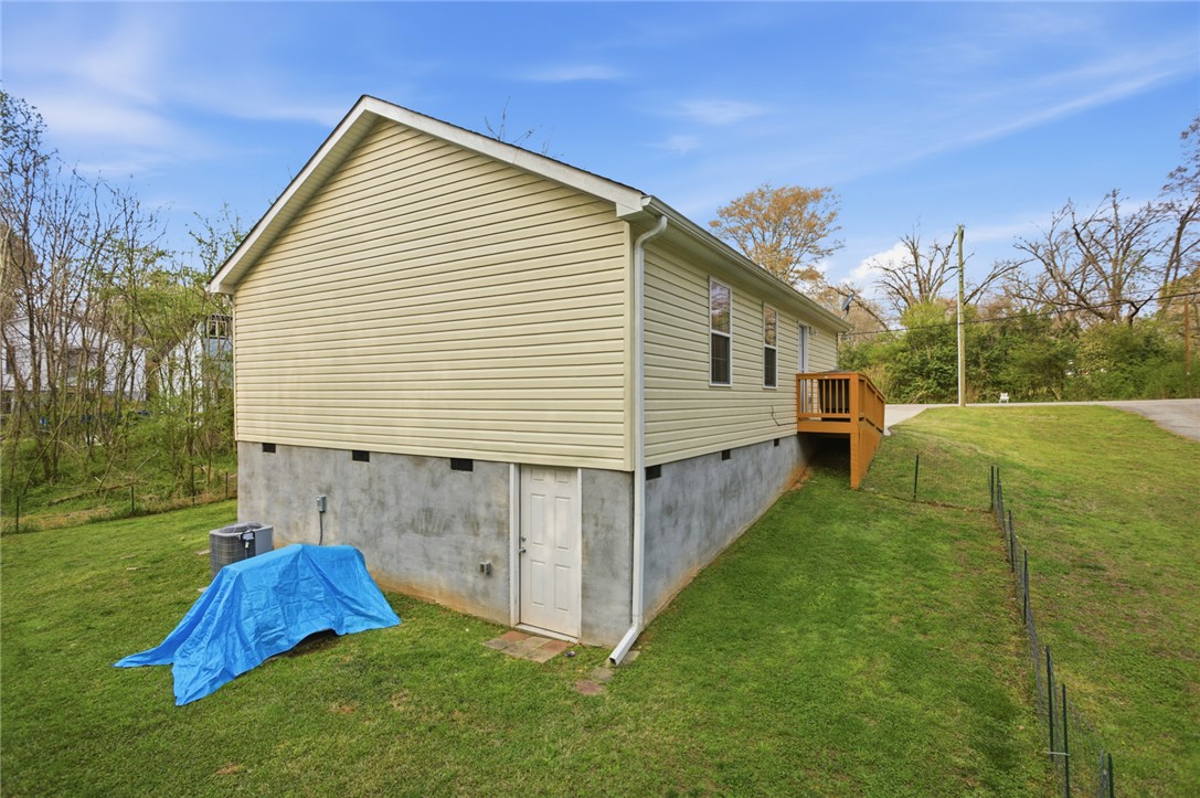 310 North Church Street Walhalla, SC 29691 - Photo 24 of 30 This residence features durable siding and a practical exterior with a functional wooden ramp.
