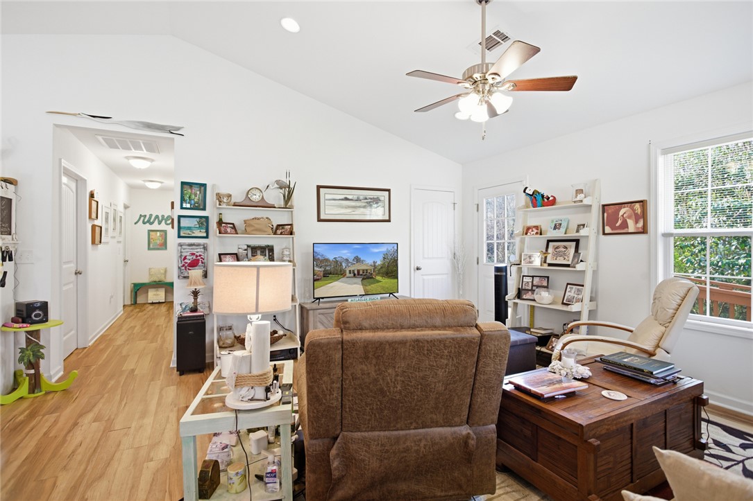 310 North Church Street Walhalla, SC 29691 - Photo 9 of 30 This bright living space features LVP flooring and vaulted ceilings, perfect for comfortable daily living.