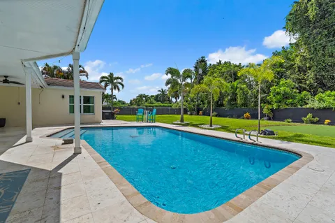 a bathroom with a sink a toilet a mirror and vanity