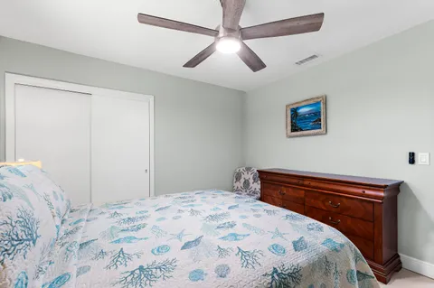 a view of a wooden chairs and bench in the garden