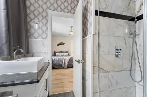 an aerial view of a house with garden space and street view