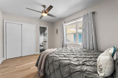 an aerial view of a house with a yard basket ball court and outdoor seating