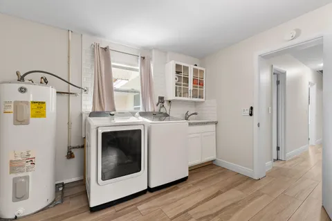 an aerial view of a house with a garden and trees