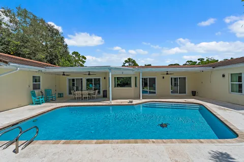 an aerial view of a house with a yard and plants