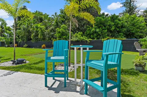 an aerial view of a house with garden space and street view