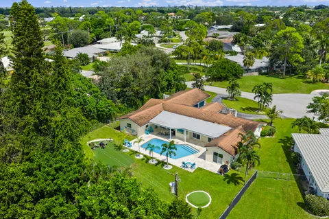 $1,125,000 | 437 North Country Club Drive, Atlantis, FL 33462