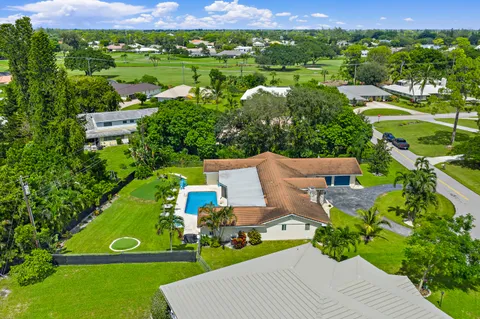 $1,125,000 | 437 North Country Club Drive, Atlantis, FL 33462