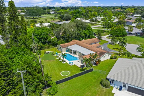 $1,125,000 | 437 North Country Club Drive, Atlantis, FL 33462