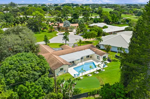 $1,125,000 | 437 North Country Club Drive, Atlantis, FL 33462