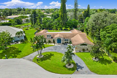 $1,125,000 | 437 North Country Club Drive, Atlantis, FL 33462