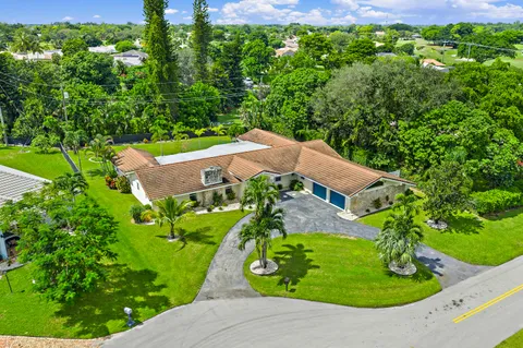 $1,125,000 | 437 North Country Club Drive, Atlantis, FL 33462