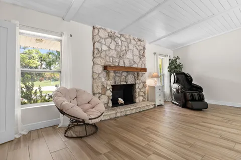 a spacious bedroom with a bed and a flat screen tv