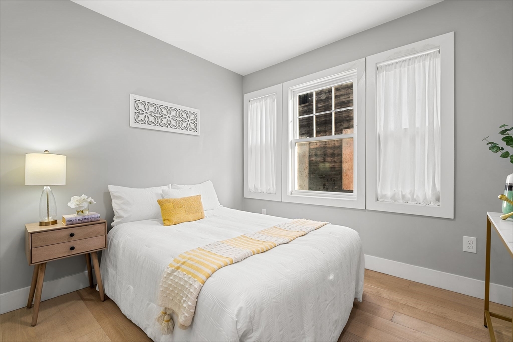 679-683 Columbia Road, Unit 1 Boston, MA 02125 - Photo 22 of 31 a bedroom with a bed and a window