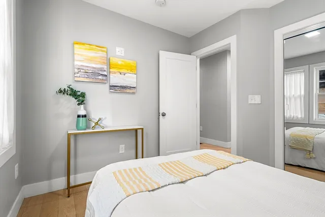 a bedroom with a bed and a dresser