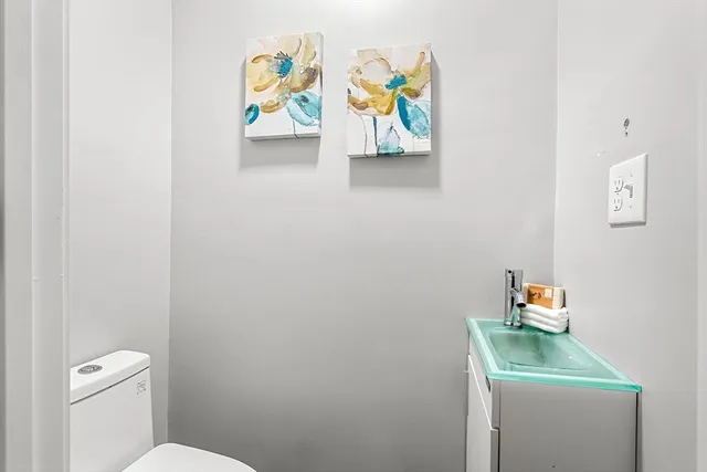 a bathroom with a toilet and a sink