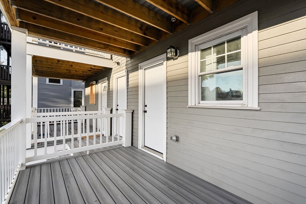 679-683 Columbia Road, Unit 1 Boston, MA 02125 - Photo 29 of 31 a view of a house with wooden floor