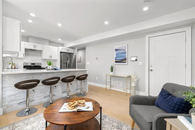 a living room with furniture and a table