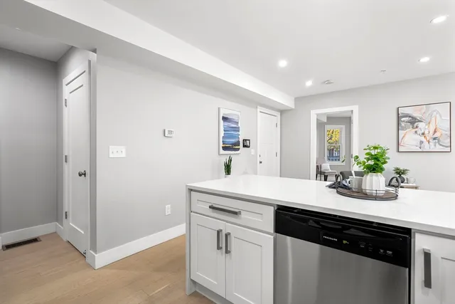 a kitchen with a sink and cabinets