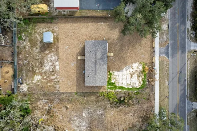 a view of a wooden door in front of a house