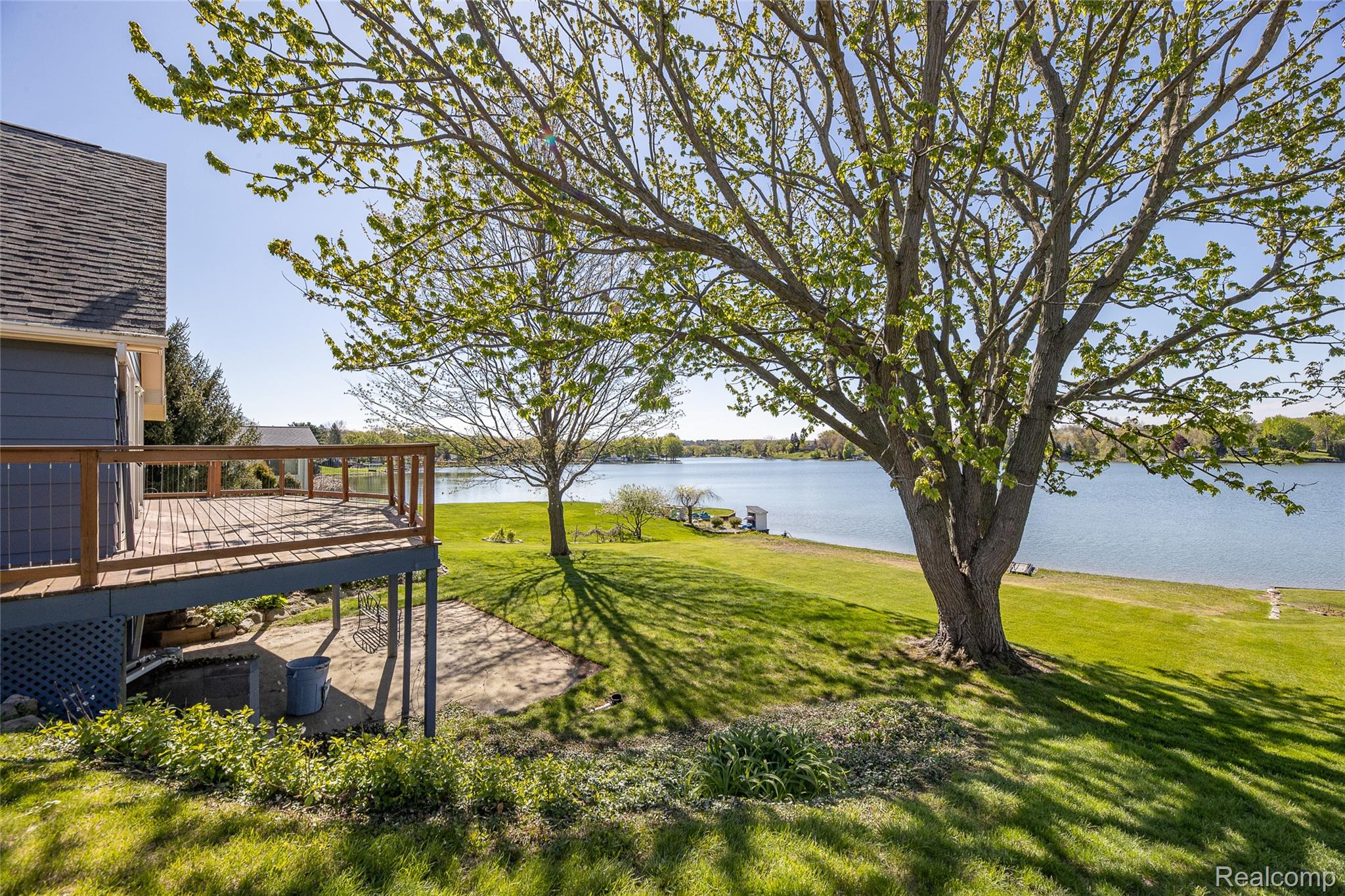 2855 Farmers Creek Road Metamora, MI 48455 - Photo 3 of 51 Elevated wood deck with railing overlooking a lake