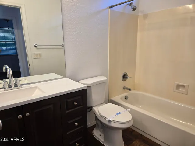 a bathroom with a shower and a bath tub