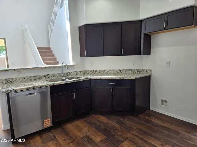 a kitchen with a sink and cabinets