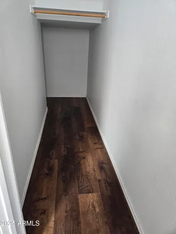 a view of an entryway with wooden floor