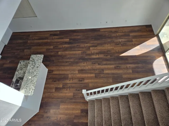 a view of kitchen with furniture and wooden floor