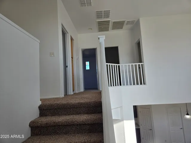 a view of a livingroom with an empty space and a window