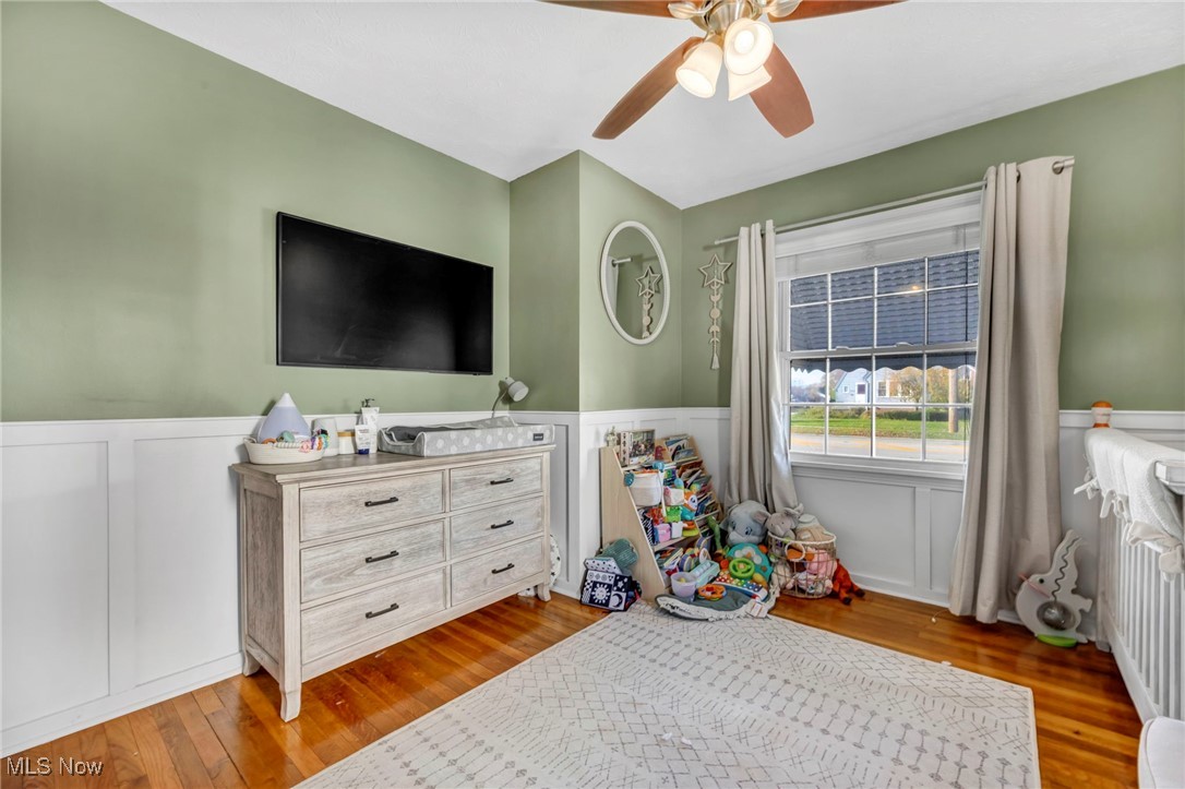 1645 Lander Road Cleveland, OH 44124 - Photo 19 of 38 Bedroom featuring light hardwood / wood-style floors and ceiling fan
