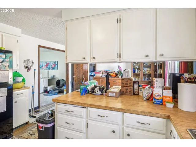 a view of a kitchen with appliances and cabinets