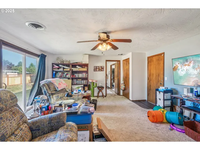a living room with lots of furniture and a flat screen tv