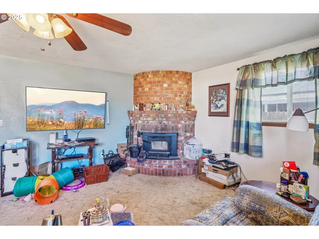 a bedroom with furniture and a fireplace